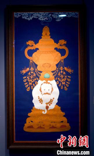 圖為5月16日，展覽中的新創(chuàng)唐卡作品《瑞象承香》?！±盍?攝